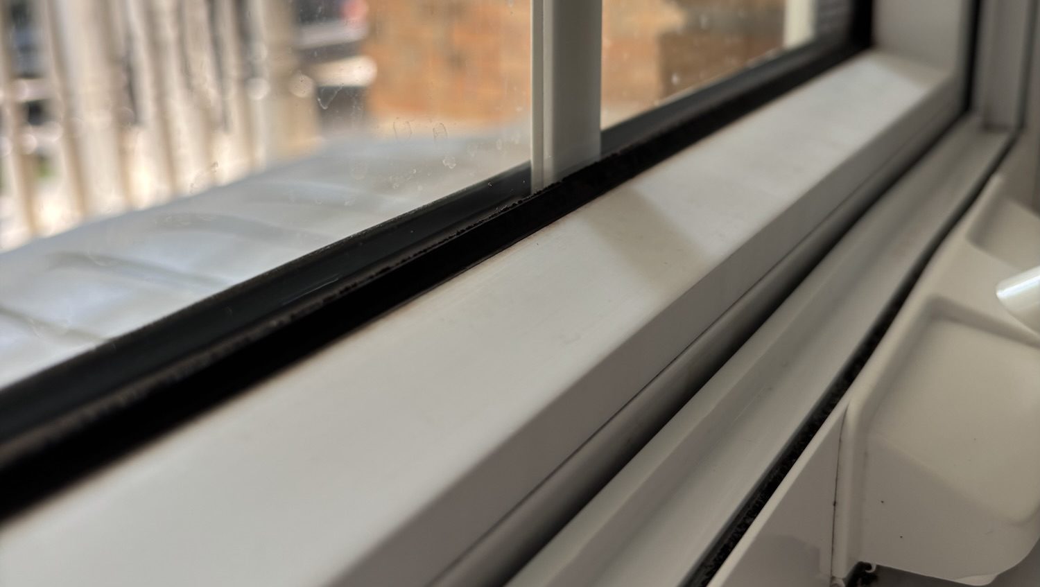 A window sill and track look clean and dust- and grime-free after cleaning from The Little Mop