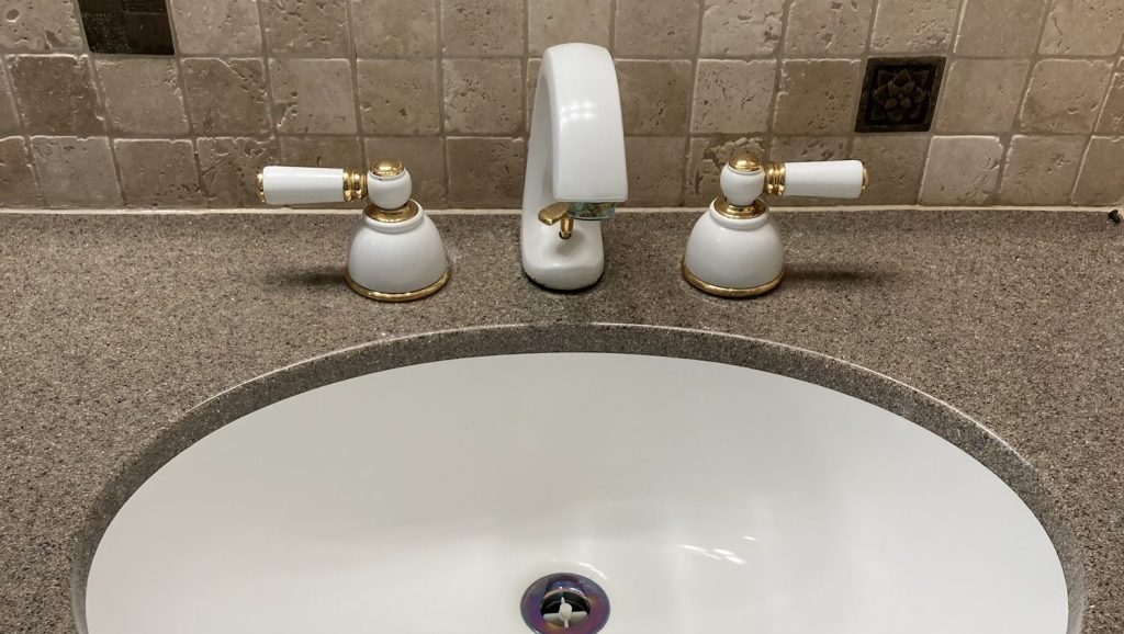 A white bathroom basin looking shiny after cleaning from The Little Mop