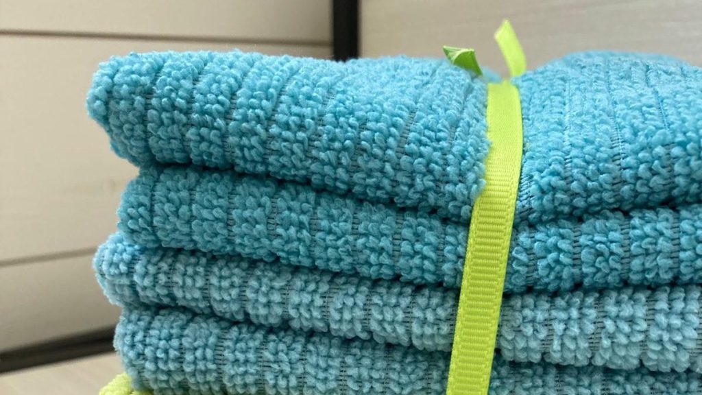 Blue microfibres tied up with green ribbon