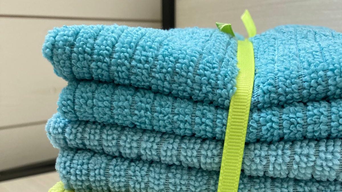 Blue microfibres tied up with green ribbon
